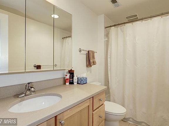 Downstairs full bathroom. Another half bathroom not pictured