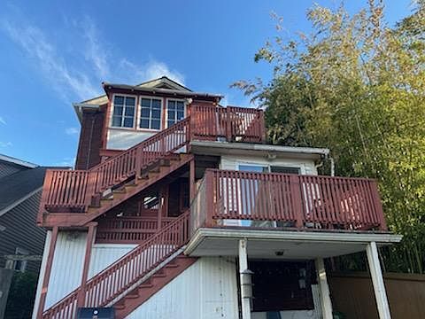 Back staircase to enter top floor.