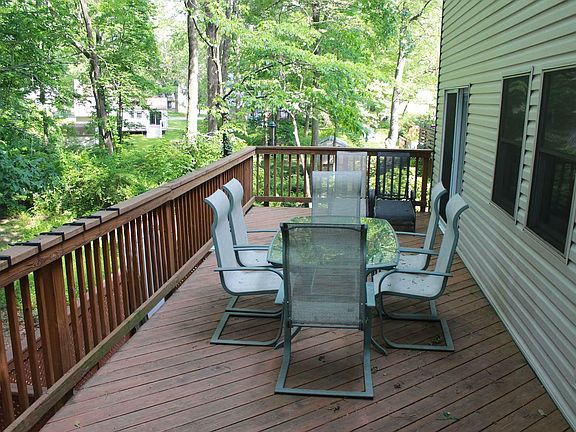 Deck that runs the entire back of the house with entrances from Dining Room and Kitchen