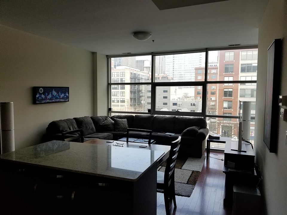 Family Room-floor to ceiling windows, hardwood floors