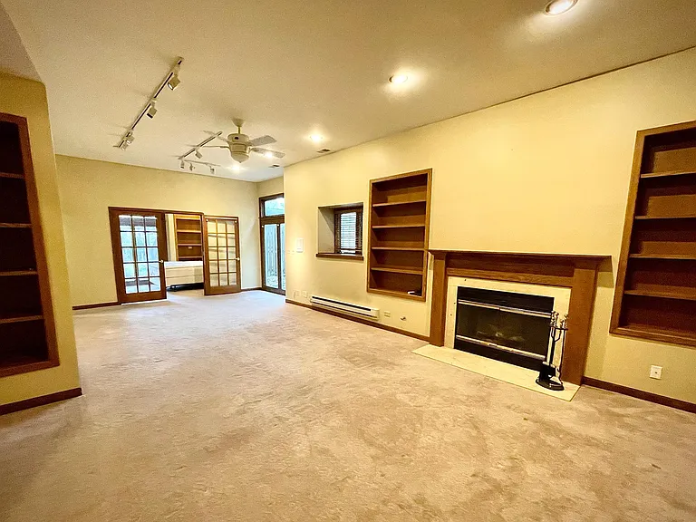 GAS FIREPLACE AND BUILT IN BOOKCASES