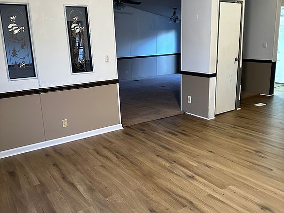 From den to Family room. Door is a pantry in kitchen