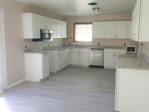 large kitchen with granite. All new stainless appliances including stove, dishwasher, microwave