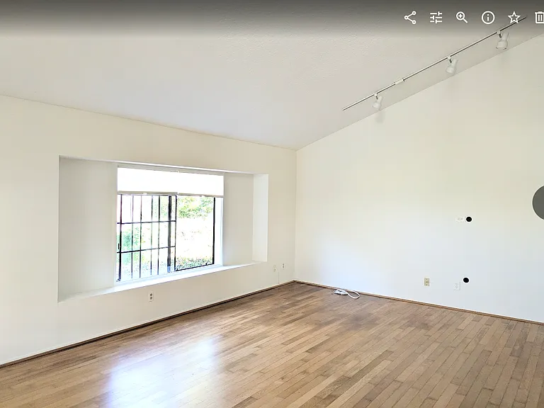 Living room with east-facing window