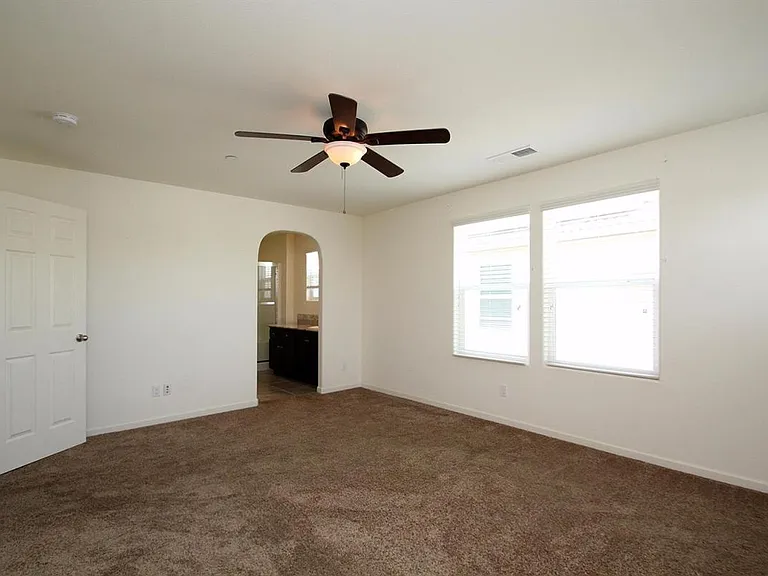 Master bedroom with ceiling fan
