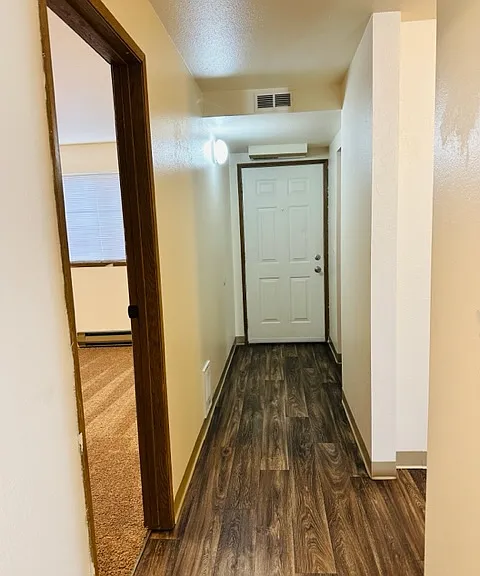 Hallway view from inside unit toward front door