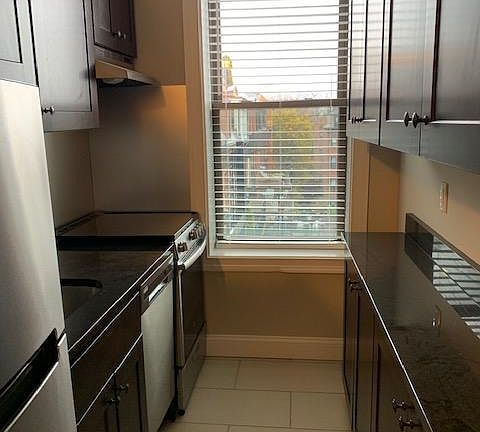 Galley kitchen with dishwasher.