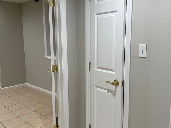 linen closet outside of bedroom