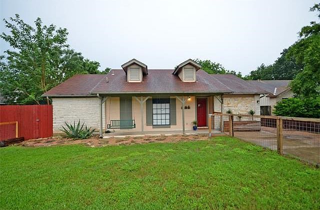 Enjoy your front yard with this covered porch and fully fenced yard.
