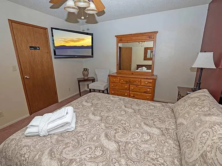 Huge master bedroom with personal TV and closet