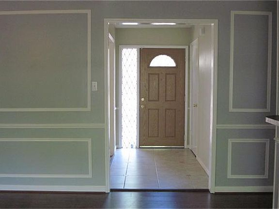 View of the home's tiled entry from the Family Room, Wet bar is to the right.