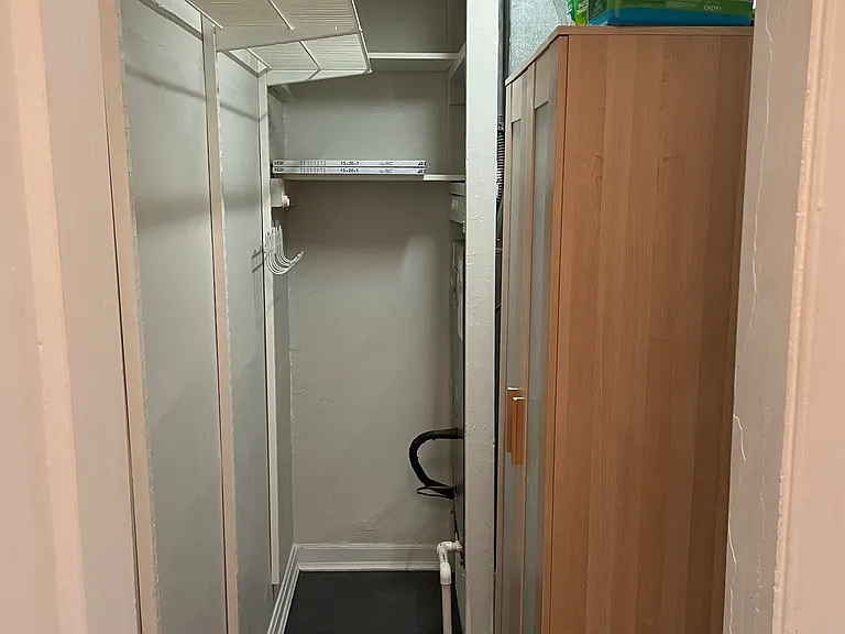 very deep coat closet/storage/HVAC room by front door