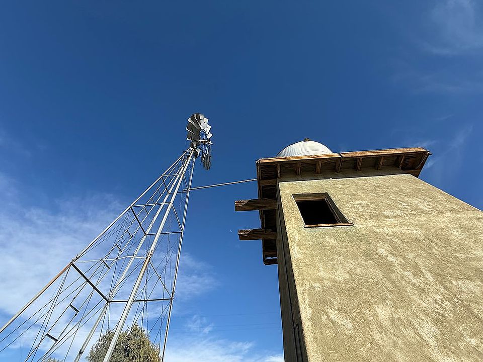 Windmill pumping well water