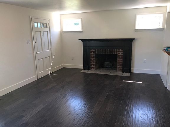 Living room with wood burning fireplace