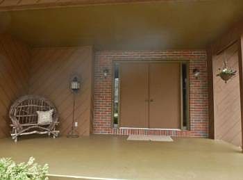 Very large covered front porch keeps your guests well out of the elements!