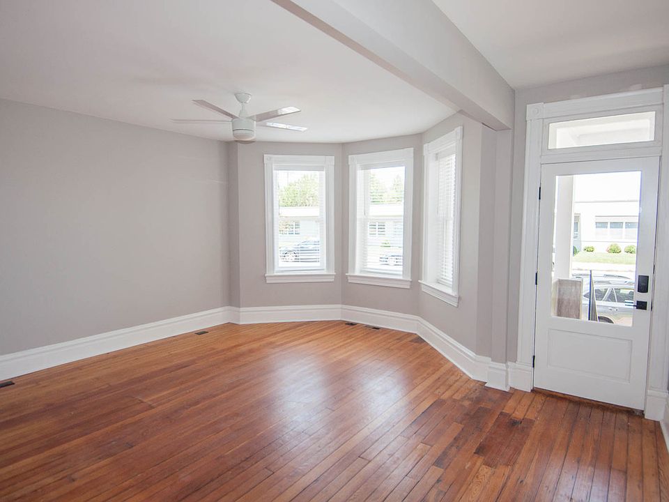 Living area with bay window and front entry