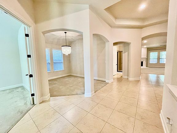 Foyer, study to far left and formal dining room