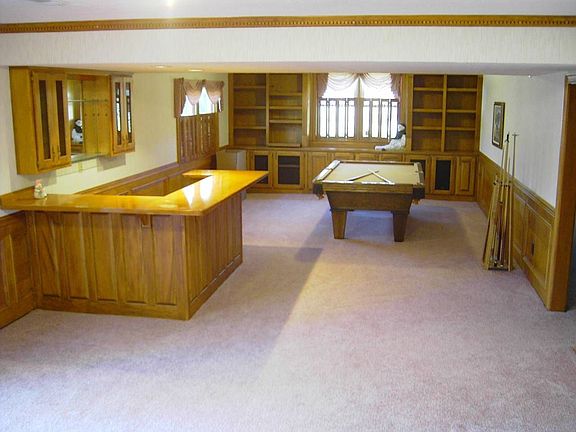 Wet Bar, Second Den, and Billiards Room on Terrace level will provide hours of