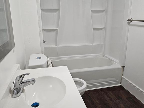Second floor bathroom with tub and shower