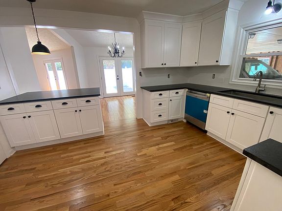 Open an spacious kitchen into the dining and living area. Kitchen counter can accompany two barstools.