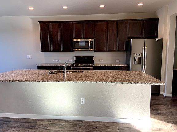 Huge kitchen island, situated between the dining area and living room.