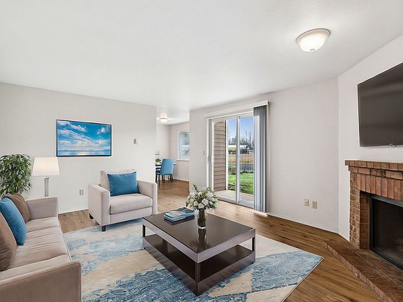 Experience comfort and warmth in this beautifully designed living area with a garden view.