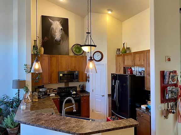 Kitchen has vaulted ceiling