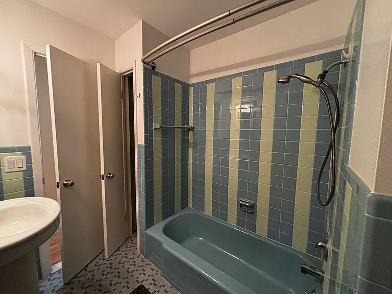 Bathroom with linen closet & laundry chute