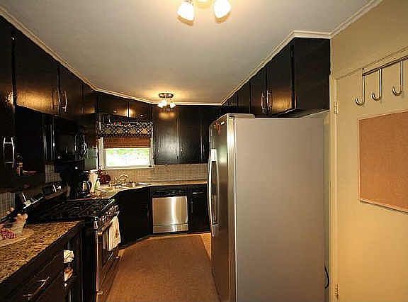 Nice layout with black granite and stainless steel applicances.