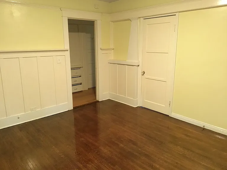 4318 Menlo - family room - newly refinished oak hardwood flooring - original craftsman-style wainscotting and china cabinet