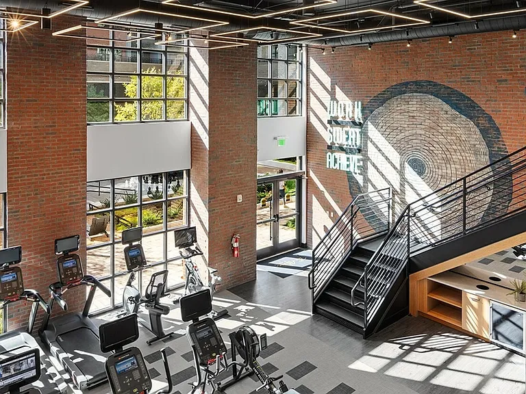 Train in a light-filled, industrial-inspired fitness center built to energize your workout and elevate your mindset.