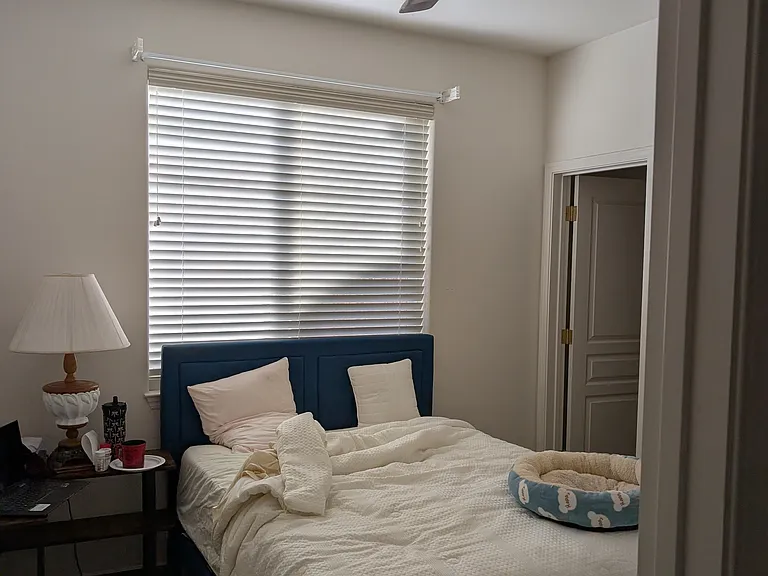 Downstairs bedroom with window to the backyard. Floors are now wood look tile.