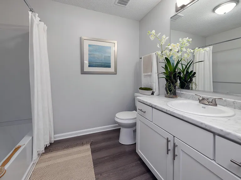 Enjoy natural lighting while you get ready in our spa-like bathroom with window and stylish features throughout