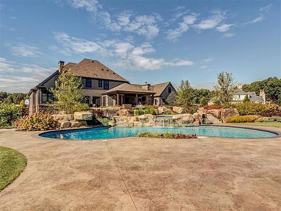 Expansive stamped concrete patio around the pool for plenty of room for friends and family to enjoy the pool and soak up some su