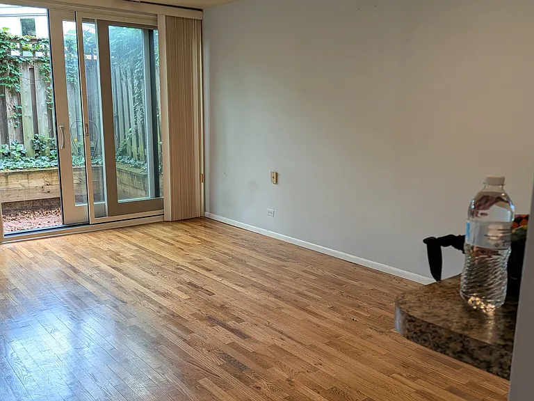 view from kitchen.
living area and outdoor patio