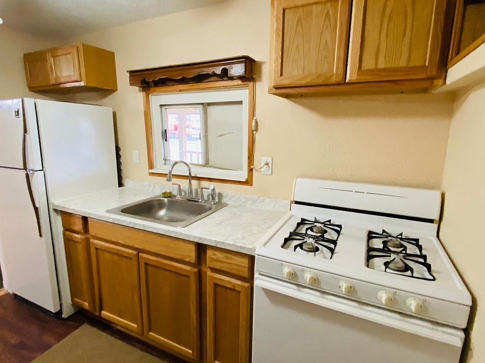 Kitchen with stove and refrigerator