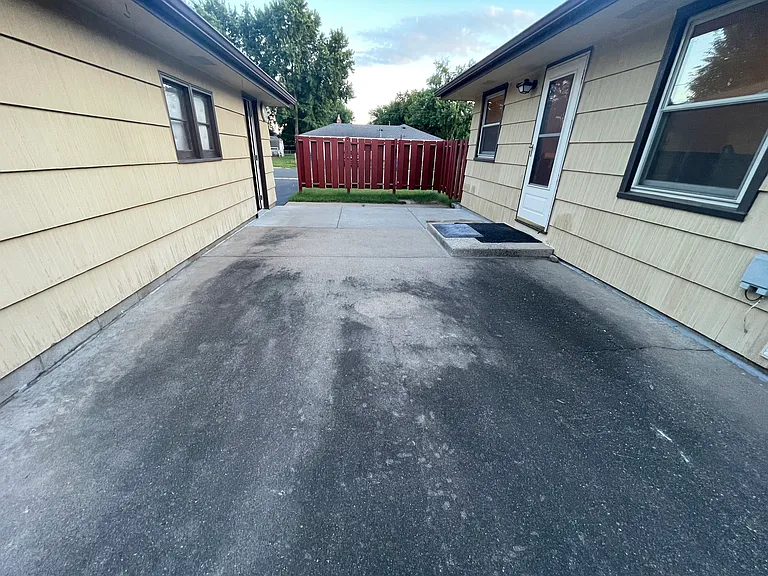 Outside porch area between house and garage