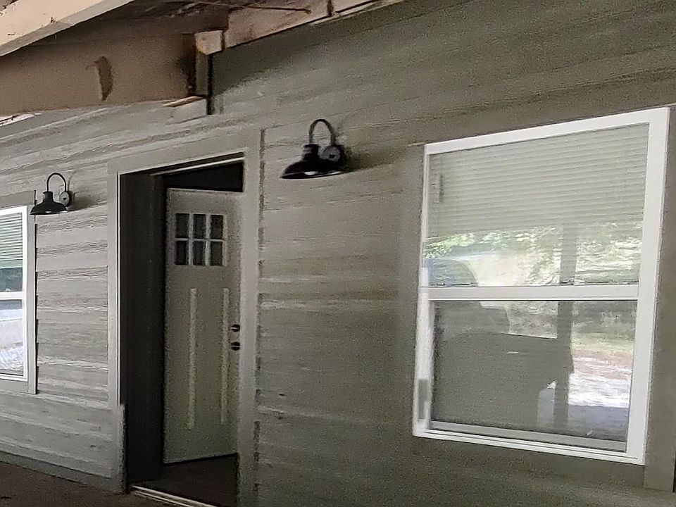 Front of apartment under carport