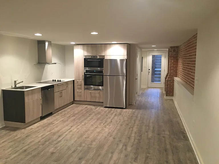 And now unfurnished, showing the entrance leading to the kitchen.