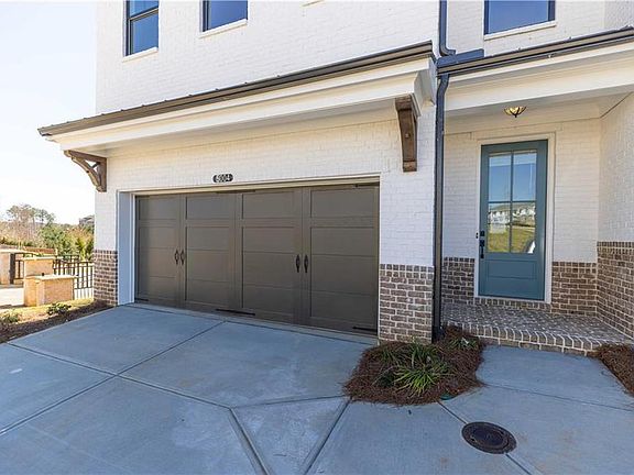2 Story Townhome Stockton floorplan. Painted white brick exterior.