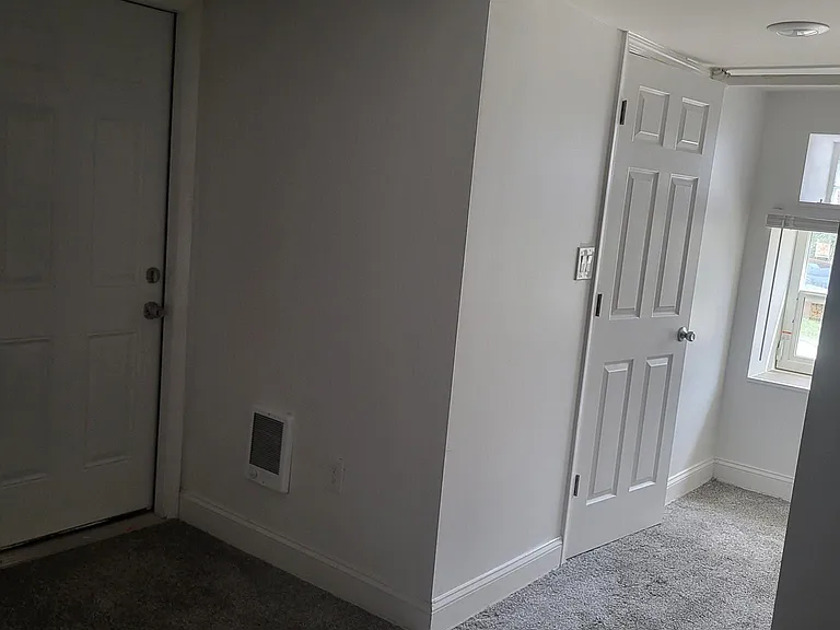 Left door lead to laundry; other door leads to bathroom