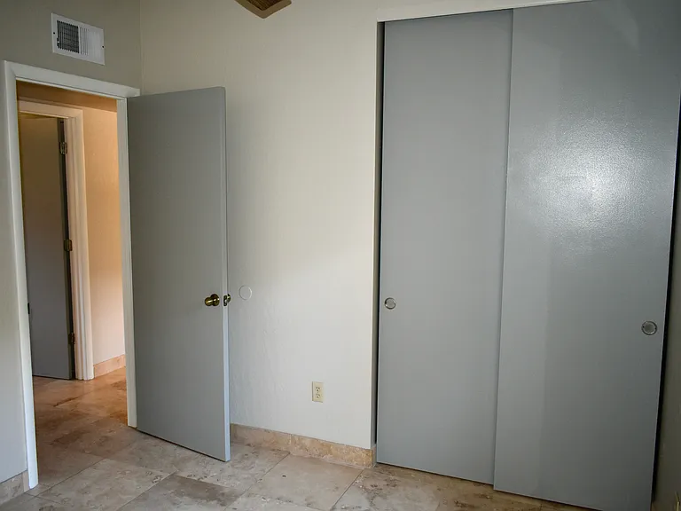 2nd Bedroom view of the Hallway and closet doors