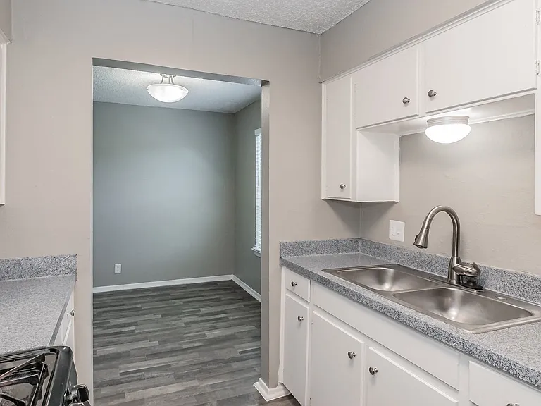 Modern kitchen featuring gas stove and ample counter space