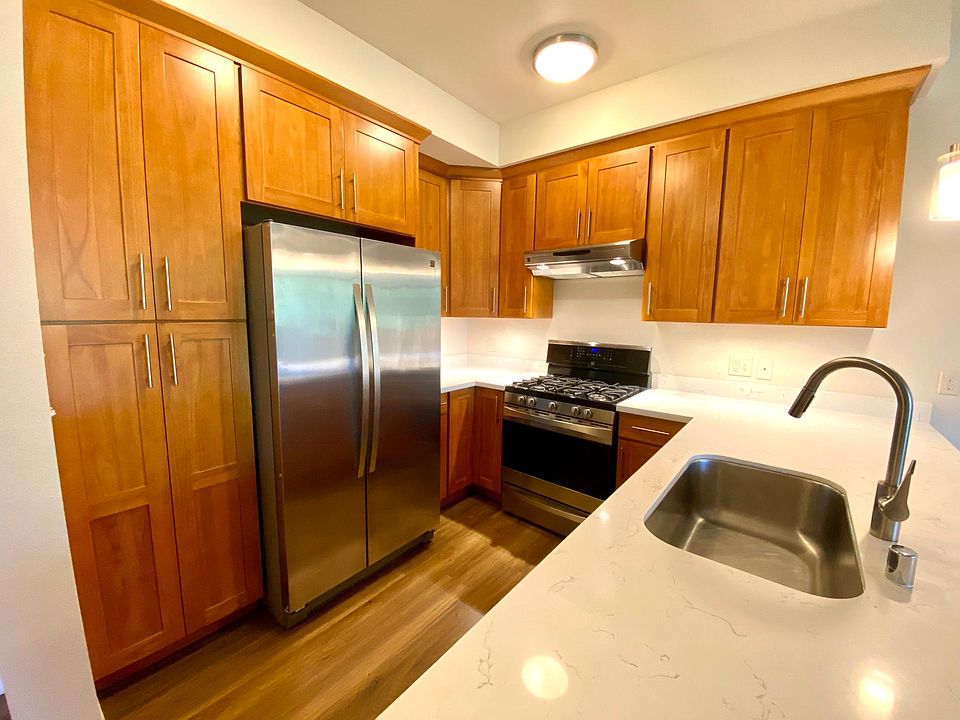 Stainless Steel appliances, quartz counter tops and a full gas stove