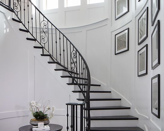 Two-story foyer with elegant curved stairs