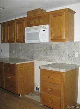 built in microwave and stone counters