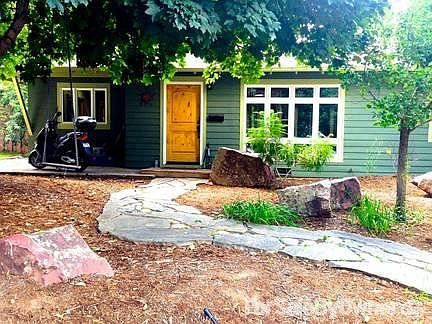 Artisan Stone Walkway
						:
						Unique stone entryway, 'moss rock' boulders & shade trees .