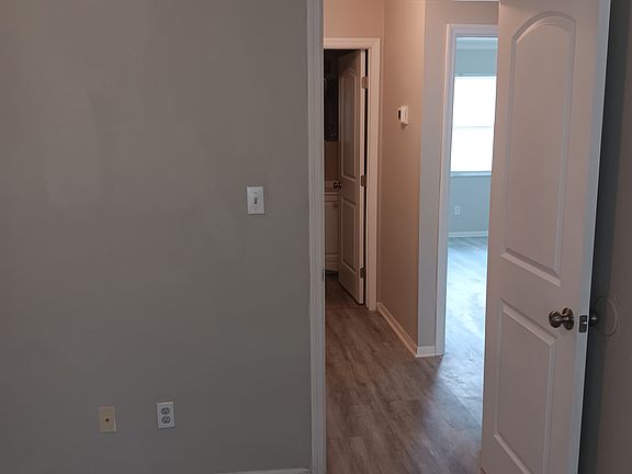 view of hallway from primary bedroom