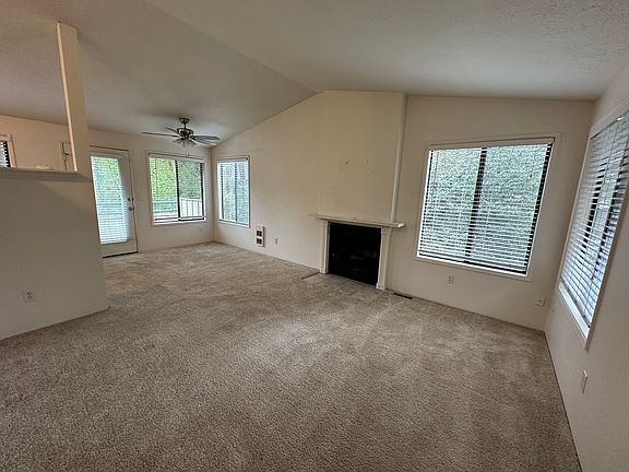 Large Vaulted Living Room with wood burning Fireplace