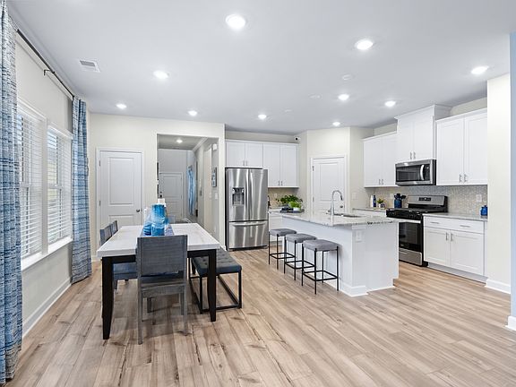Enjoy weeknight meals or fun dinner parties in the kitchen and dining area.